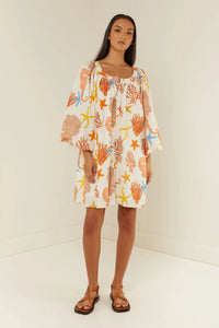 Cotton poplin dress that buttons through in a coral print with self tie belt
