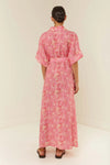 Palm tree print shirt dress in pinks and reds with short sleeves rear view