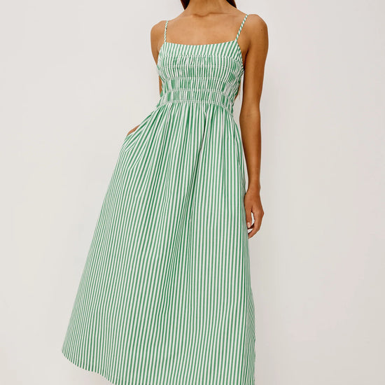 Woman wearing white and green stripe dress from rails