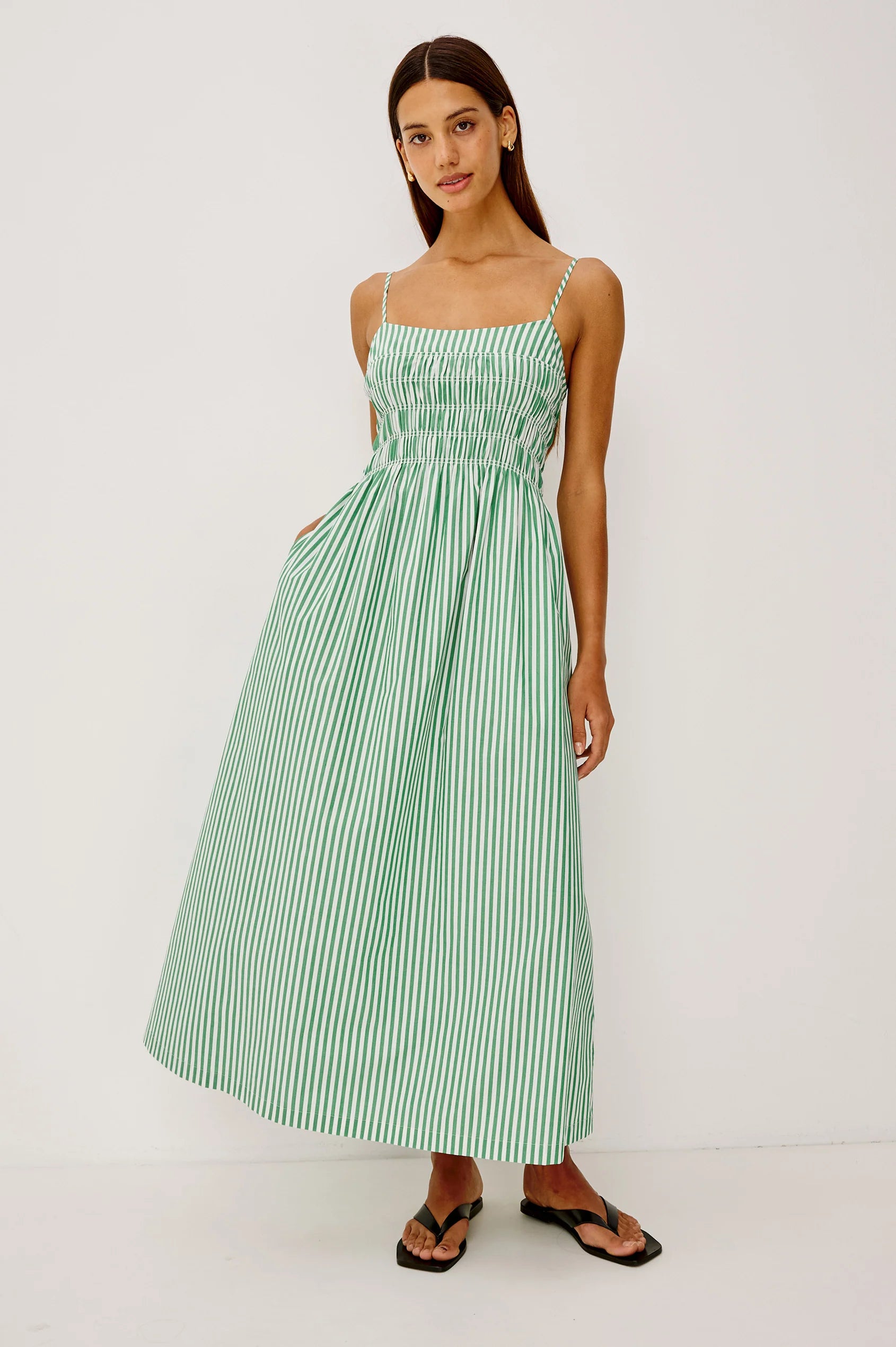 Woman wearing white and green stripe dress from rails