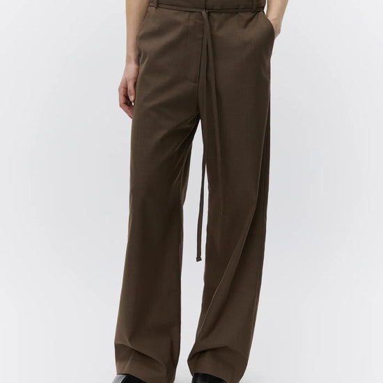 wide leg brown suit trousers with self tie at the waist from day birger  model shot