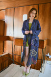 navy dressing gown with vibrant parsley seed flowers all over from one hundred stars model shot