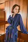 navy dressing gown with vibrant parsley seed flowers all over from one hundred stars model shot