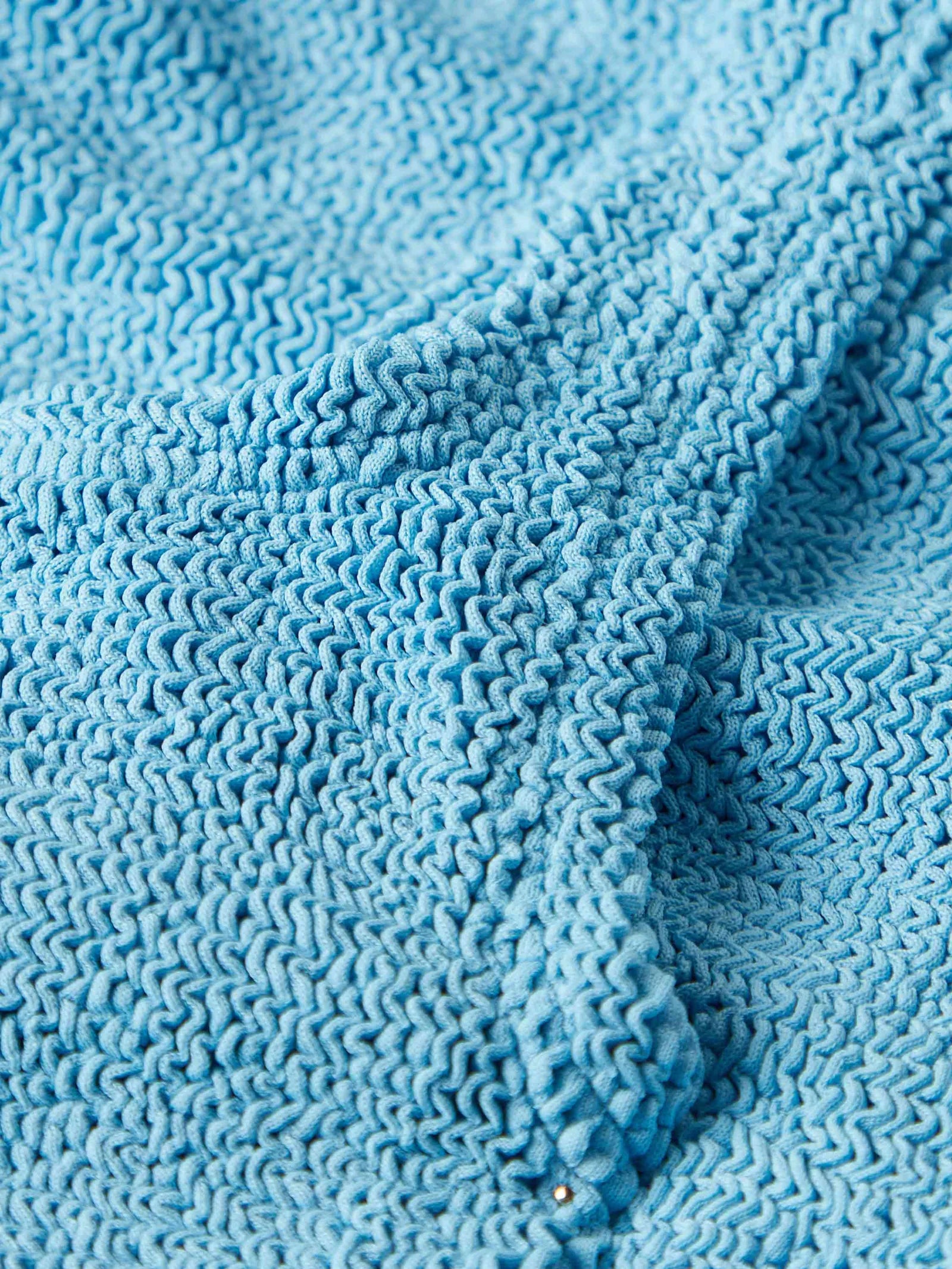 sqaure neck crinkle sky blue swimsuit from hunza g close up of fabric