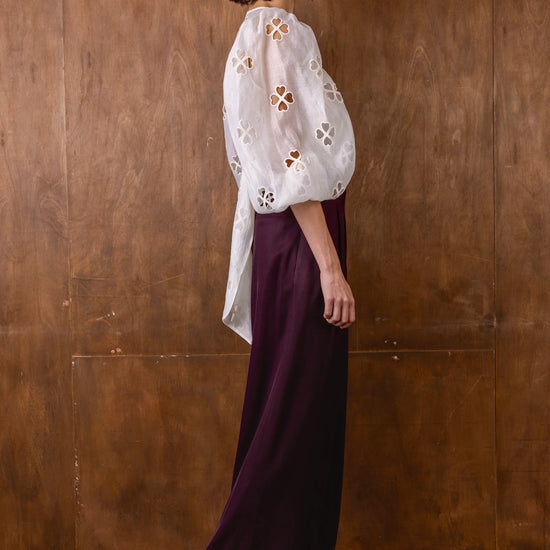 v neck sheer white blouse with tie at the front and blouson sleeves side view