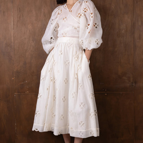 v neck sheer white blouse with tie at the front and blouson sleeves model shot