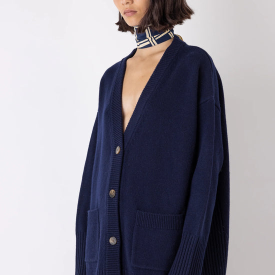 Navy cardigan worn with neckscarf