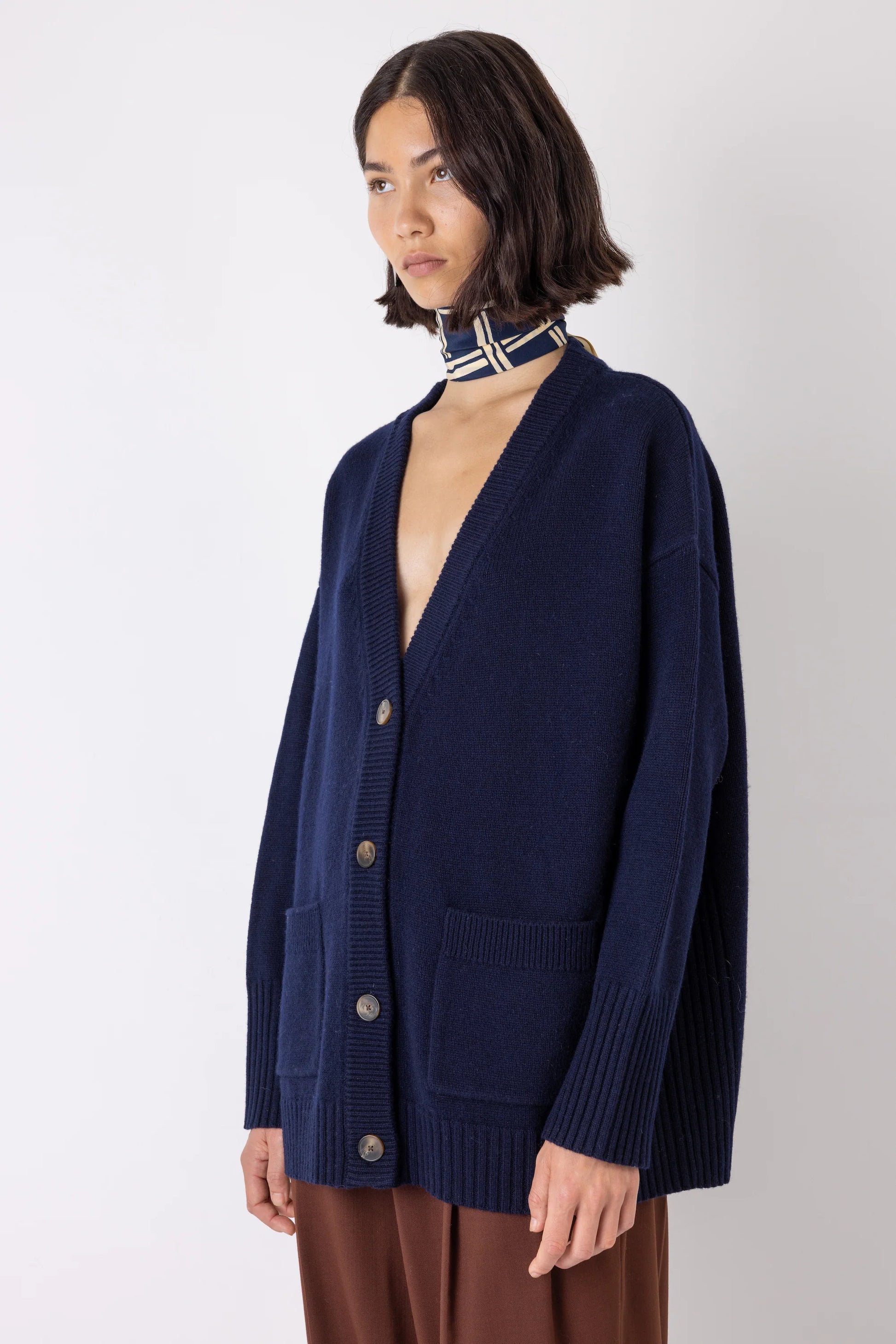 Navy cardigan worn with neckscarf