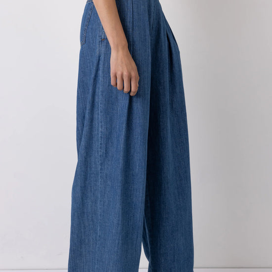 wide leg high rise denim blue jeans with pleated front side view
