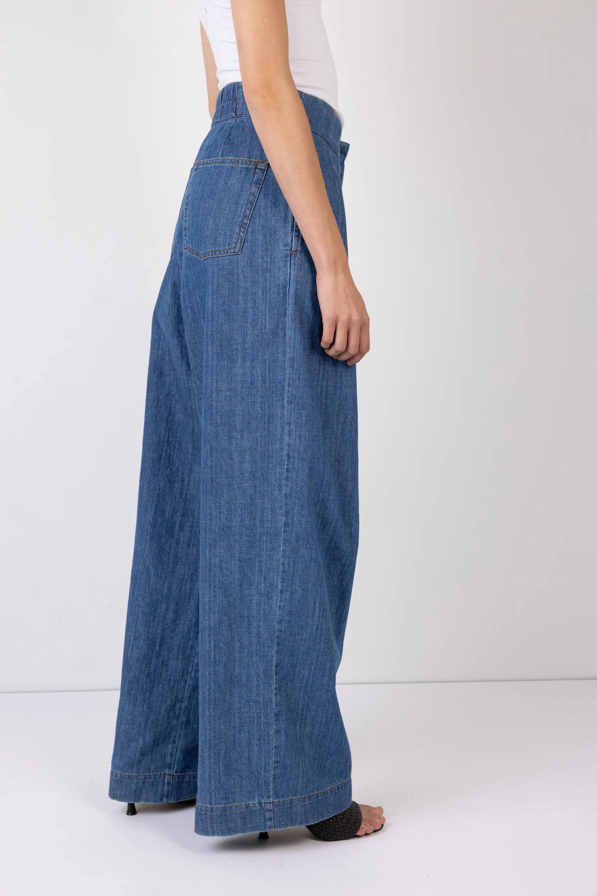 wide leg high rise denim blue jeans with pleated front rear view