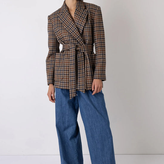 wide leg high rise denim blue jeans with pleated front model shot