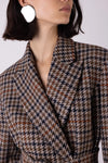 Close up of brown check blazer