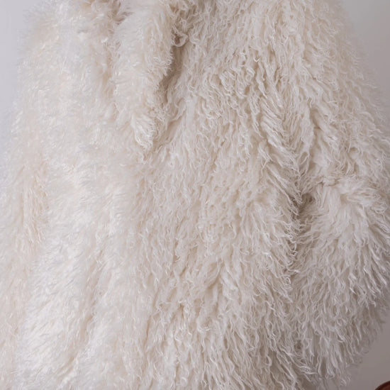 Cream shaggy faux fur jacket close up