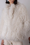 Cream shaggy faux fur jacket close up