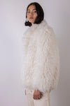 Cream shaggy faux fur jacket side view