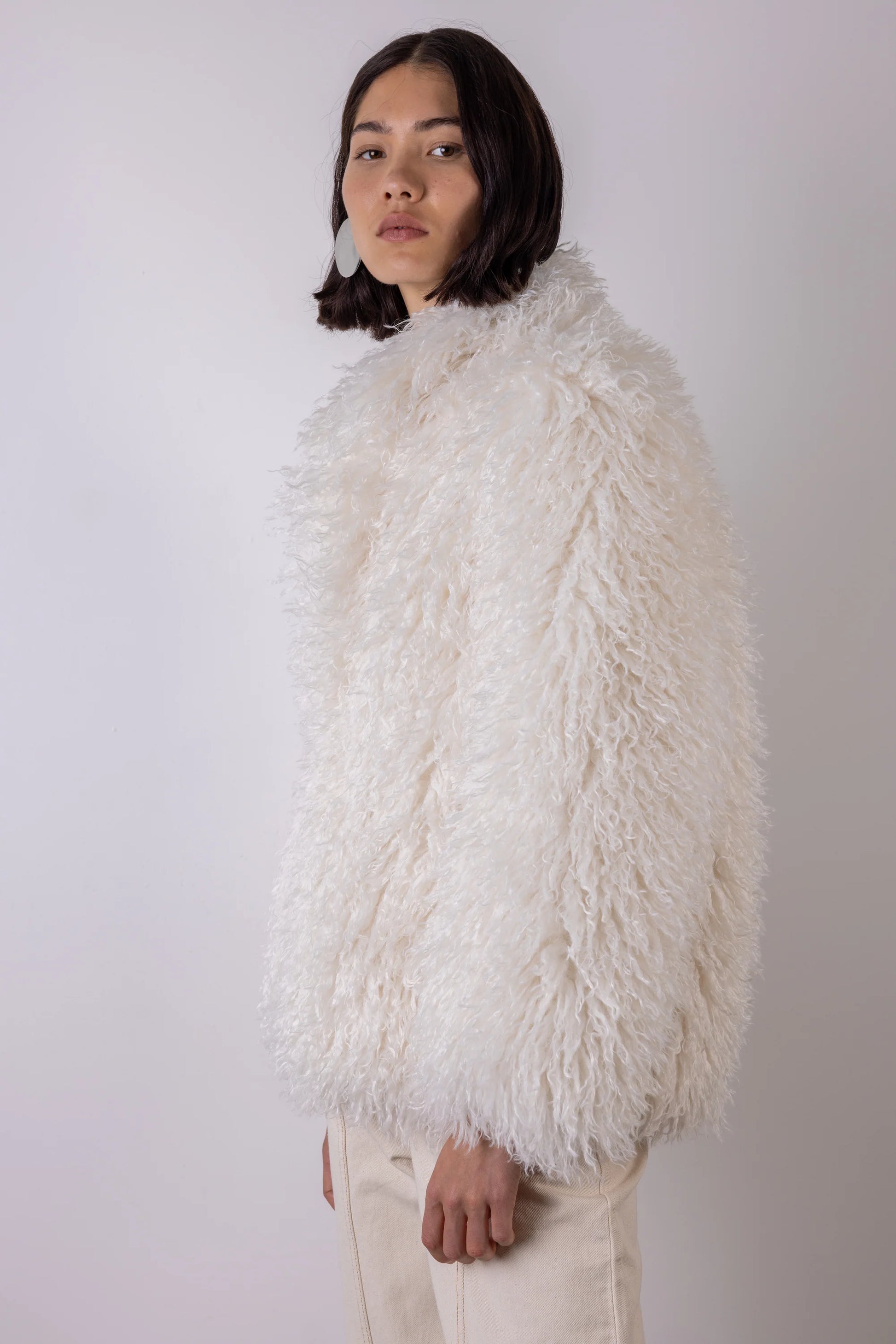 Cream shaggy faux fur jacket side view