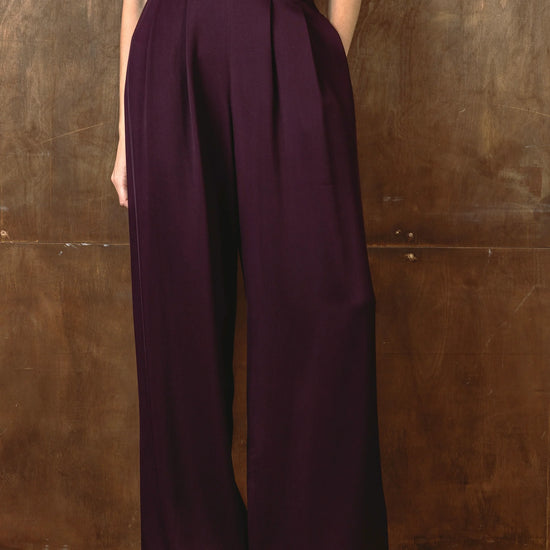 Close up of burgundy wide leg trousers