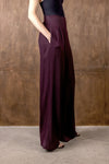 Side view of burgundy wide leg trousers