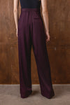 Rear view of burgundy wide leg trousers