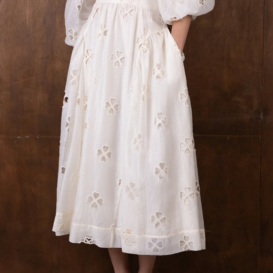 white semi sheer skirt with cut out details