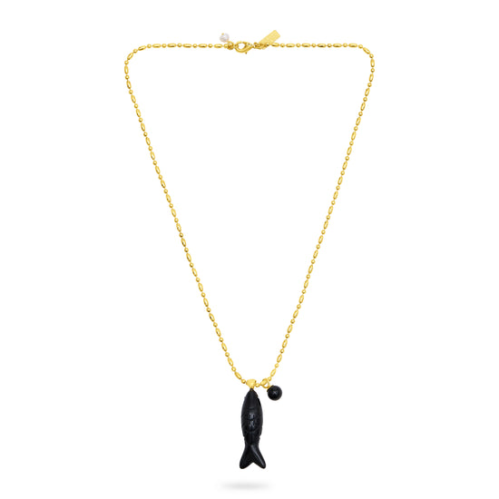Gold necklace with a black fish pendant on a white background from talis chains