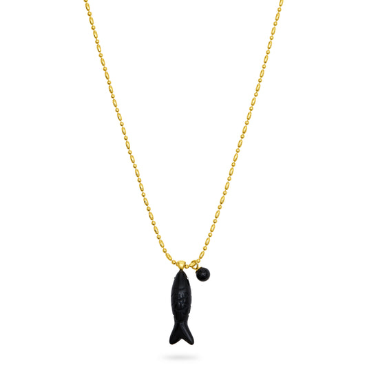 Gold necklace with a black fish pendant on a white background from talis chains