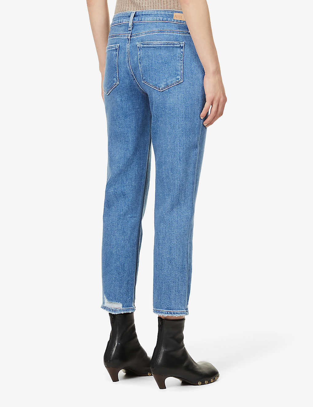 Boyfriend skinny jeans in a mid wash and distressing classic five pocket design