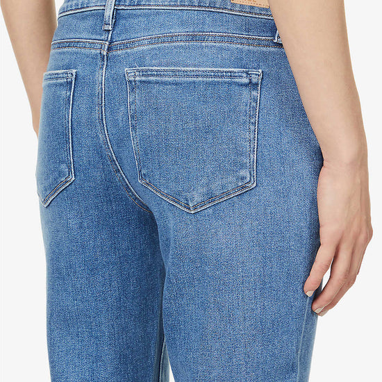 Boyfriend skinny jeans in a mid wash and distressing classic five pocket design