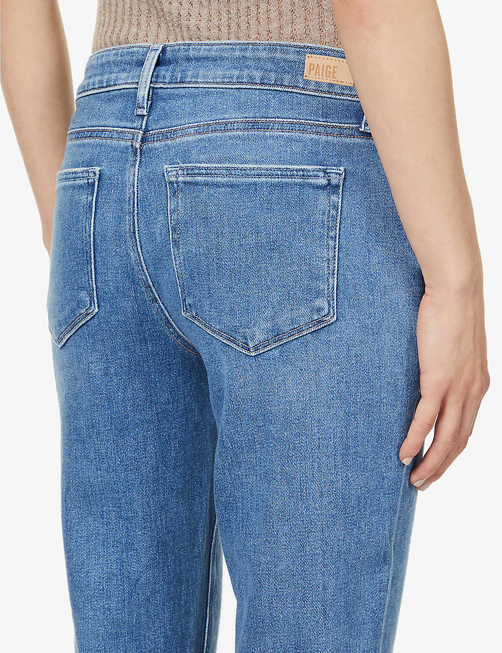 Boyfriend skinny jeans in a mid wash and distressing classic five pocket design