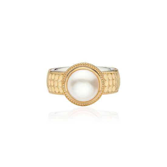 gold dotted ring with pearl in the centre