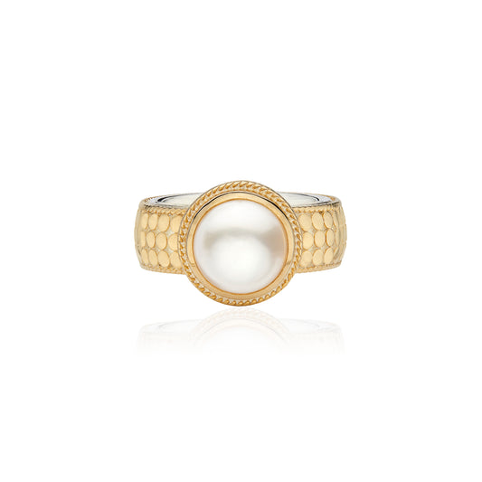 gold dotted ring with pearl in the centre