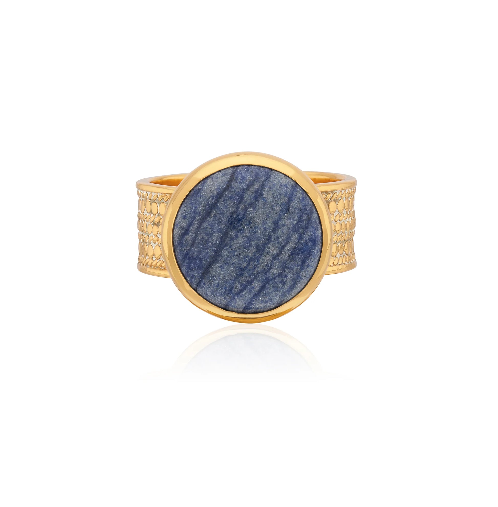 Cocktail ring with a blue stone on a gold band