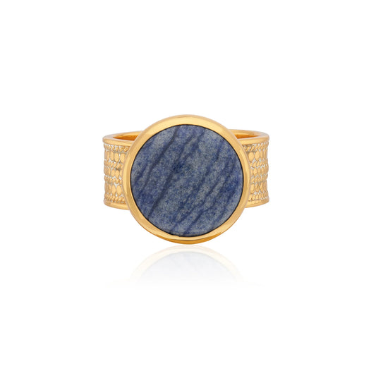 Cocktail ring with a blue stone on a gold band