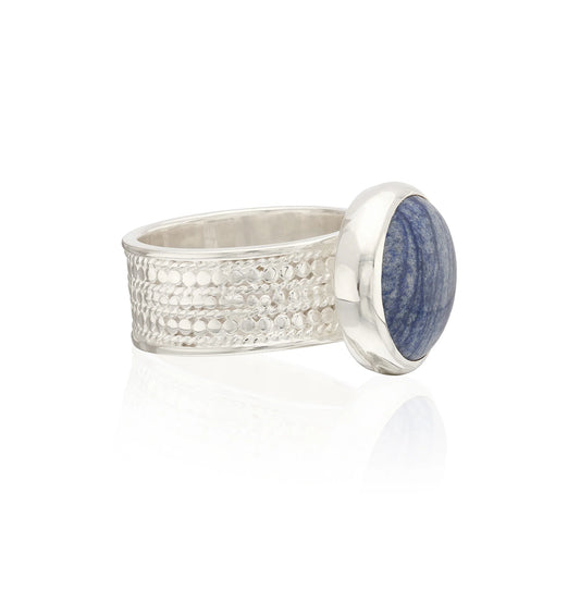 Side view of silver ring with blue stone