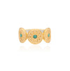 Gold ring with turquoise stones on a white background