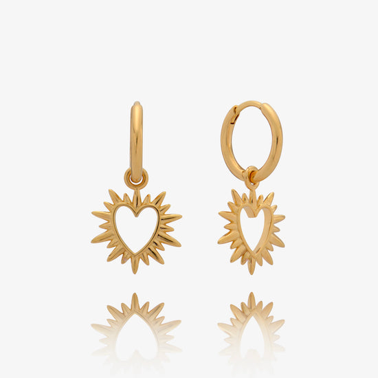 small huggie gold earrings with spiky gold heart charms from rachel jackson 