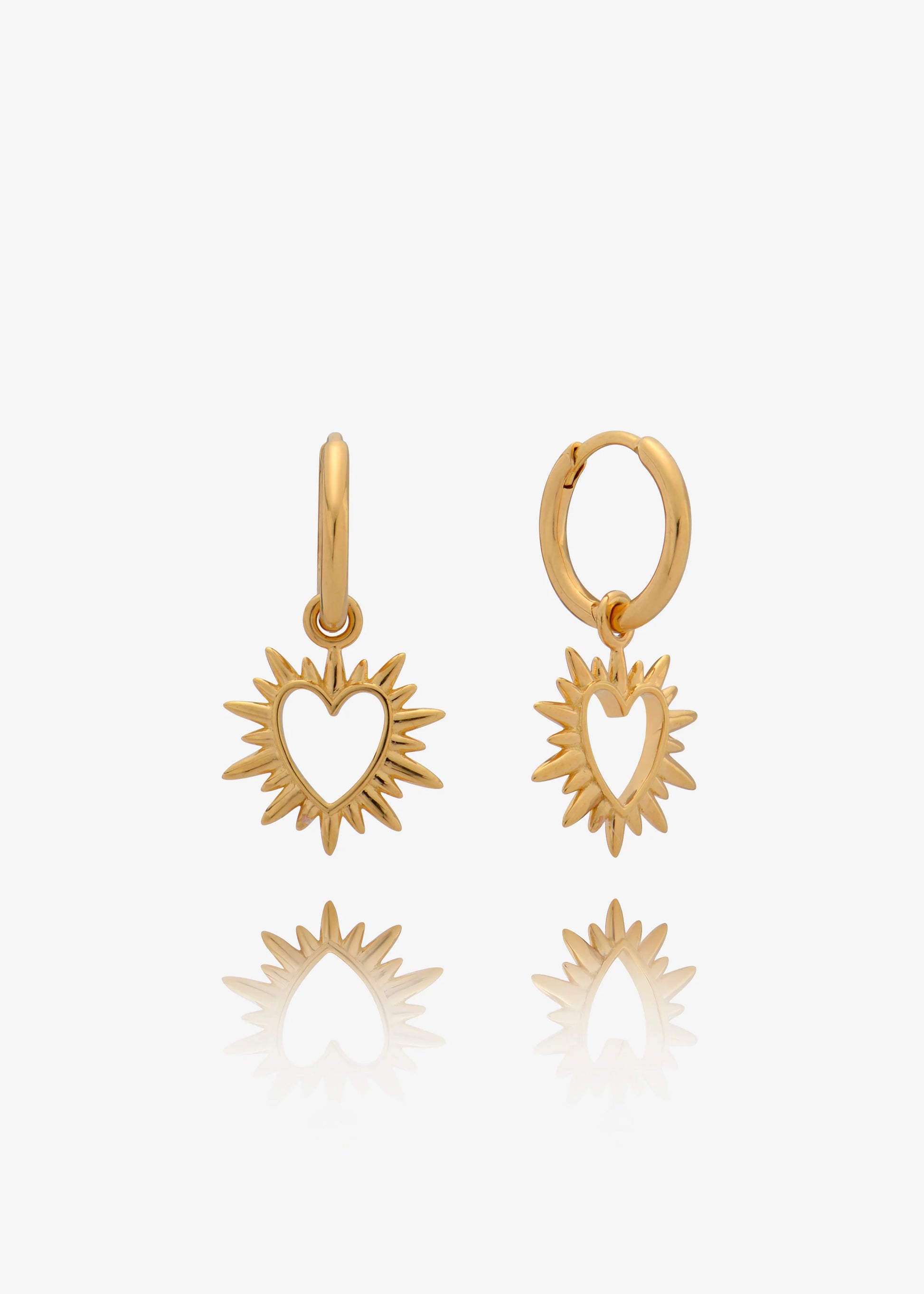 small huggie gold earrings with spiky gold heart charms from rachel jackson 