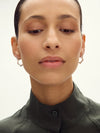 large silver hexagon shaped hoop earrings from claudia bradby model shot