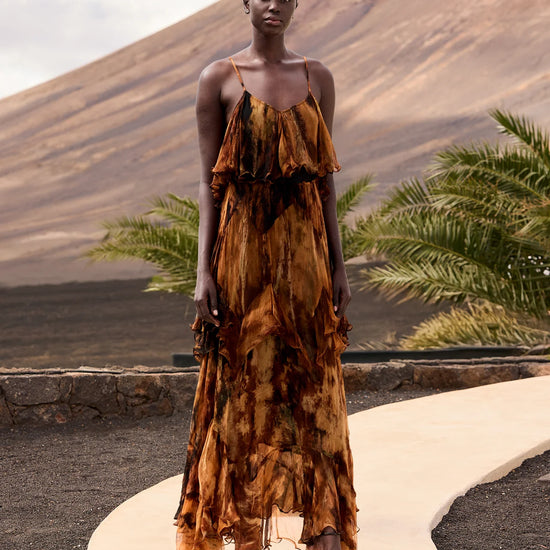 Model of tiered tie dye dress with spaghetti straps