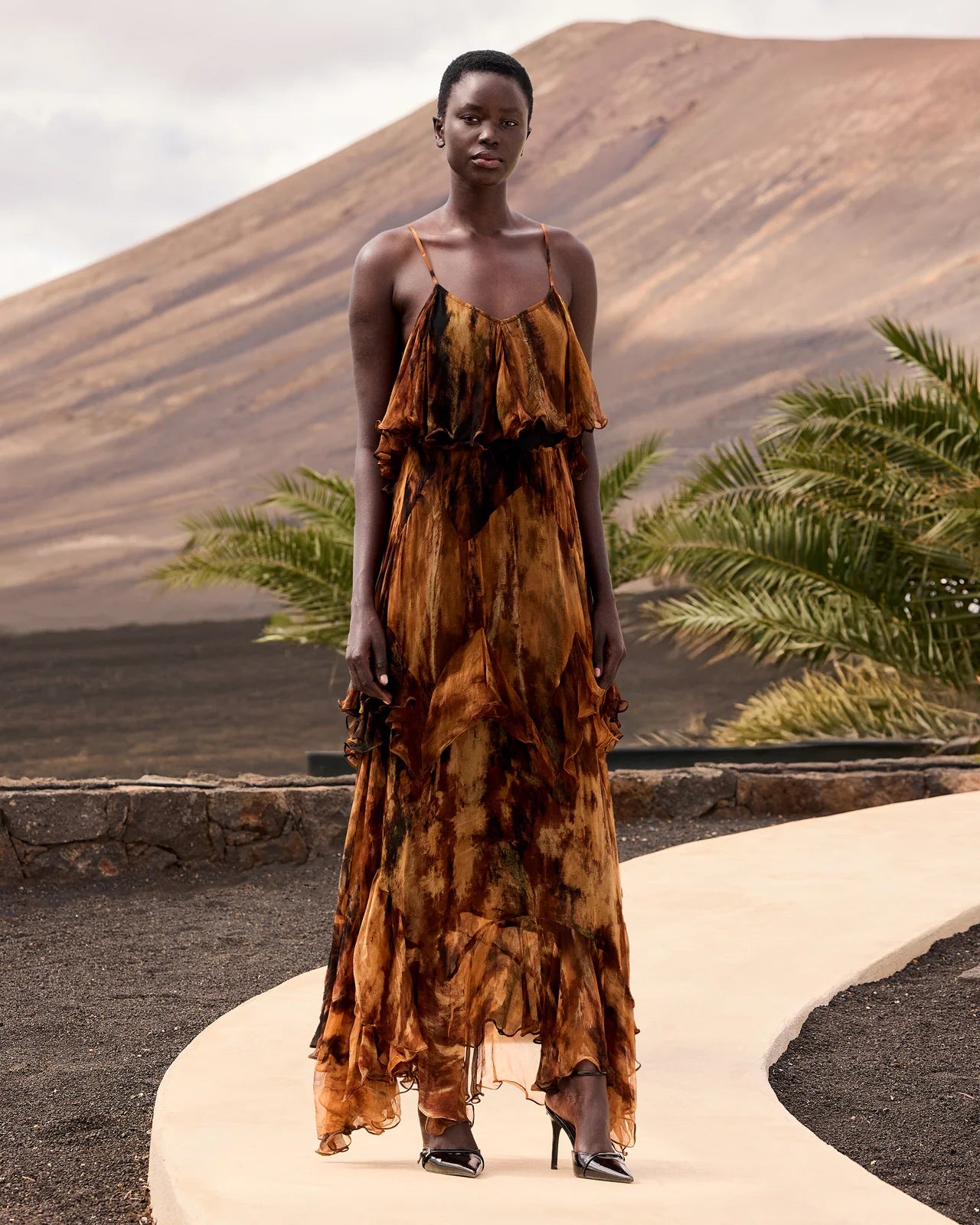 Model of tiered tie dye dress with spaghetti straps