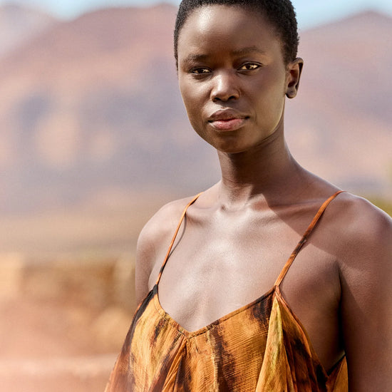 Close up of neckline on tie die dress with spaghetti straps