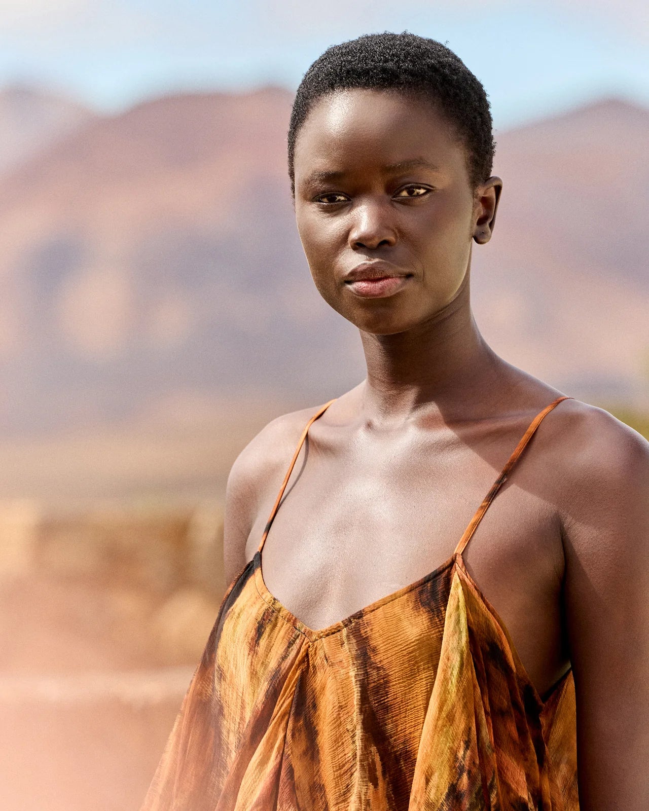 Close up of neckline on tie die dress with spaghetti straps