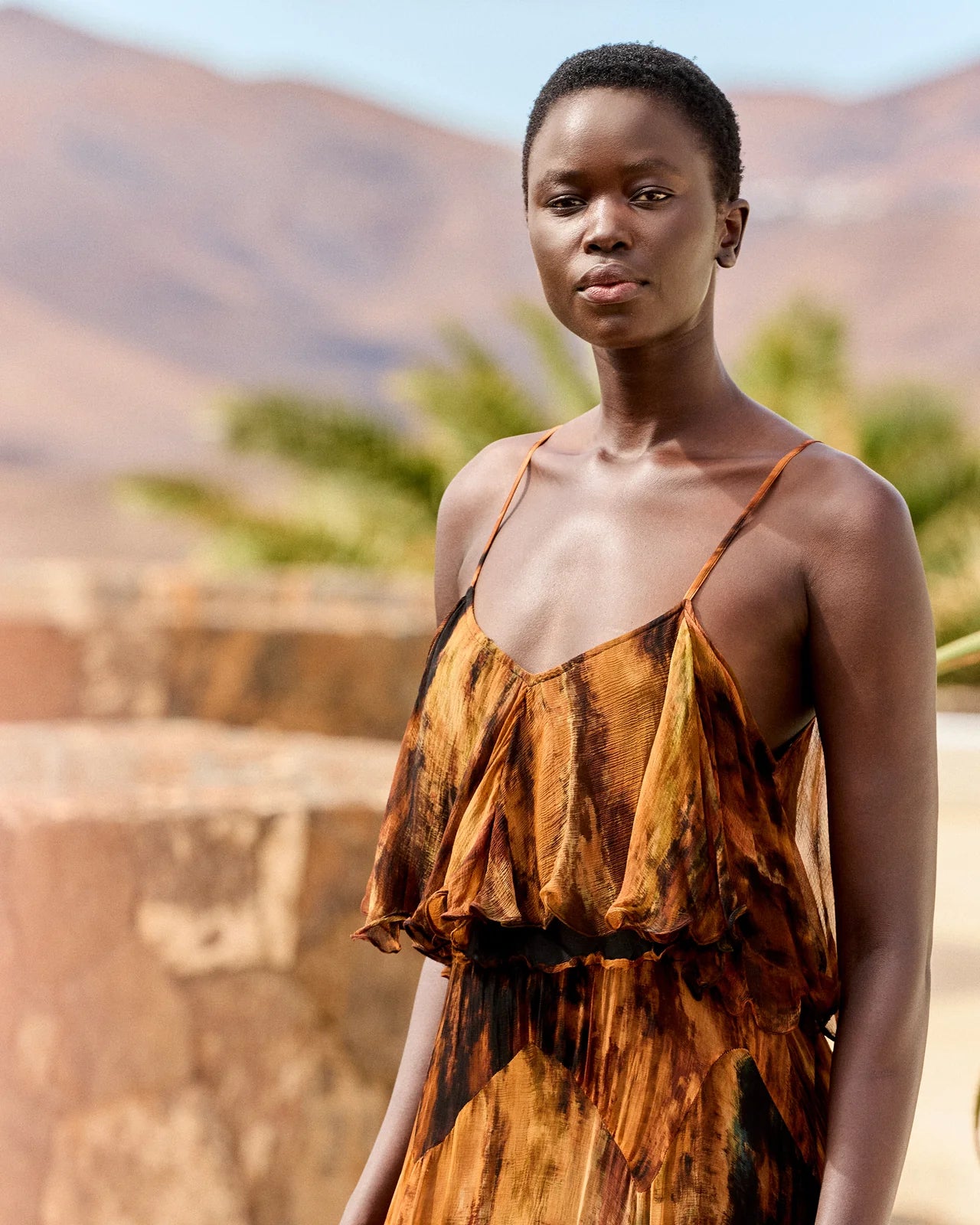 Close up of upper  body dress with tiers and spaghetti straps