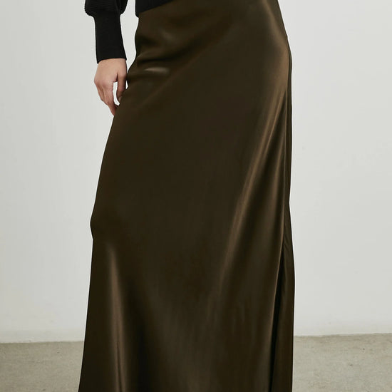 dark green brown long skirt with elasticated waist and a line shape