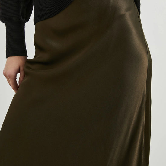 dark green brown long skirt with elasticated waist and a line shape close up