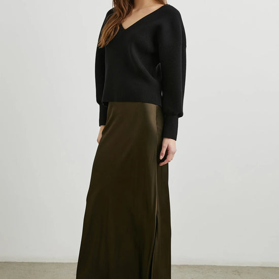 dark green brown long skirt with elasticated waist and a line shape side view 