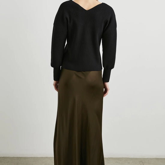 dark green brown long skirt with elasticated waist and a line shape rear view 