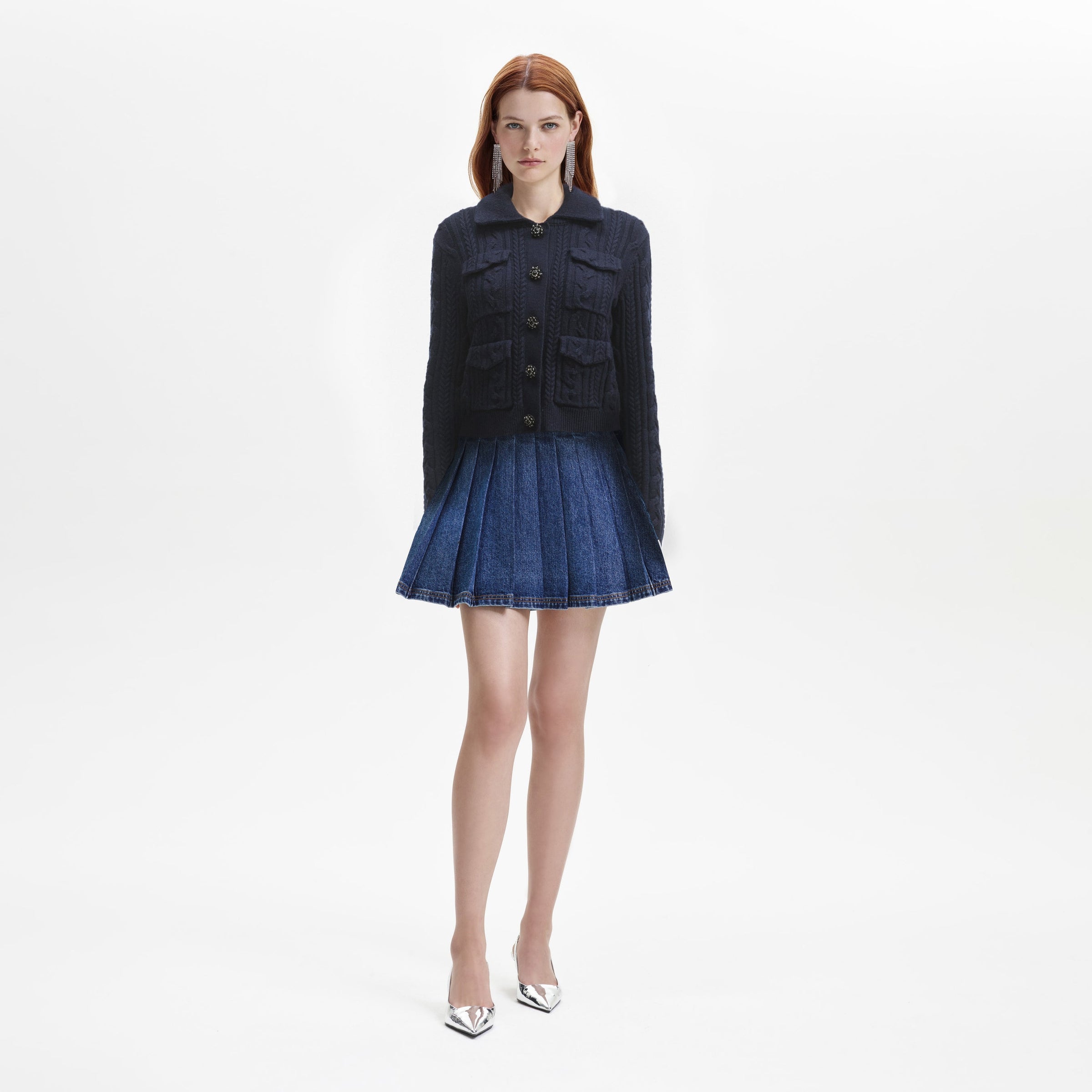 Navy collared cable knit cardigane with collar four patch pockets and decorative diamante and beaded buttons
