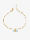 Gold bracelet with a blue stone on a white background