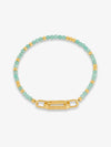Bracelet with green beads and gold clasp on a white background